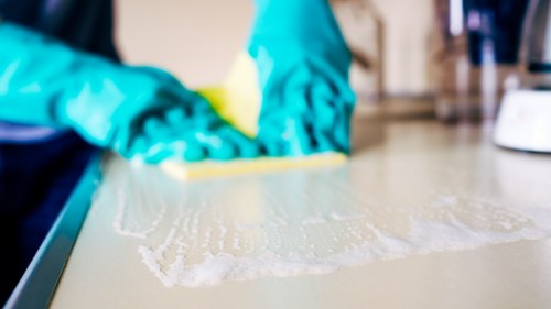 Professional carpet cleaners completing a safe cleaning service
